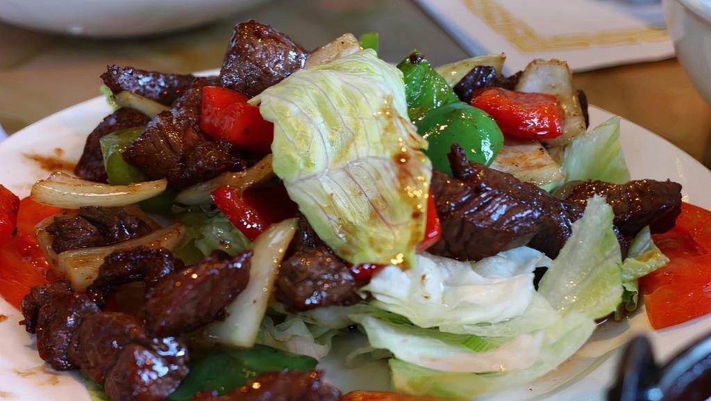 Bò Lúc Lắc - Shaking Beef over salad · 