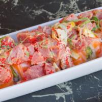 Yummy Yummy Roll (10 Pcs) · Ikura, white tuna, avocado, top salmon, seaweed salad, lemon, jalapeno, tobiko, tuna, tobiko...
