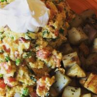 Migas · Scrambled with two eggs, green onions, tomatoes, serrano chilies and asiago mixed together. ...