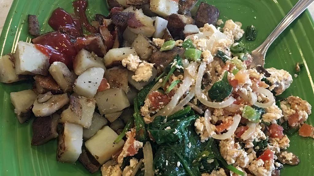Southwest Tofu Scramble · Tofu, onion, bells and spinach sauteed in our Ranchero sauce.  Served with home fries and toast.