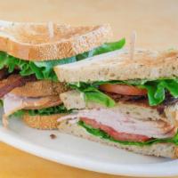 Turkey Club · Classic club sandwich with turkey, bacon, lettuce and tomato on rye.
