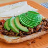 Carnitas Suprema Sandwich · Our home-made carnitas stuffed in a ciabatta roll, along with avocado and our own Salsa Fres...