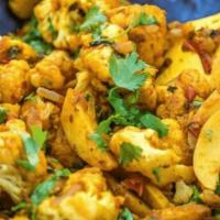 Aloo Gobi · Potatoes and cauliflower cooked with spices.