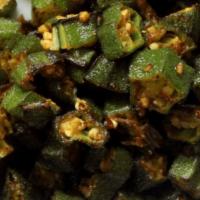 Bhindi Masla (Vegan)  · Okra cooked with a special blend of spices and onions & tomatoes.