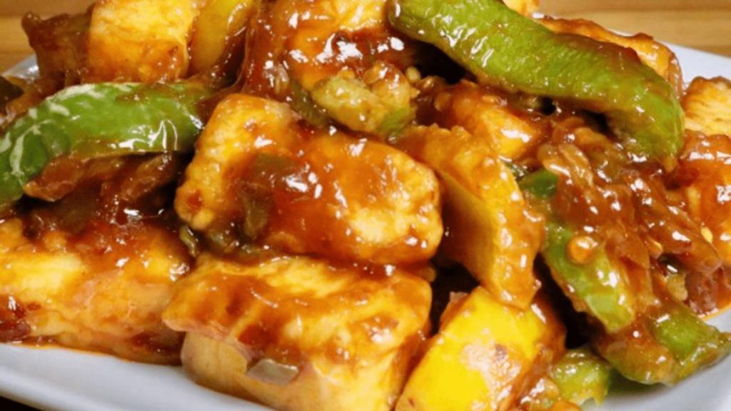 Chilli Tofu (Vegan) · Delicious Tofu tossed with bell peppers, onions and  tomatoes with touch of fresh cilantro.