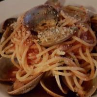 Spaghetti alla Puttanesca · Spaghetti with black olives, capers, anchovies and spicy tomato sauce.