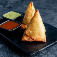 Samosa(2pc) · Triangular fried pastry with a savoury filling of spiced vegetables.