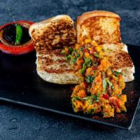 Veg Keema Pav · Minced plant meat cooked with indian masala and paired with Indian soft brioche.