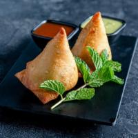 Samosa(1pc) · Triangular fried pastry with a savoury filling of spiced vegetables.