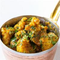 Aloo Gobi Methiwala · Onion kadai masala and methi tossed with potato and cauliflower.