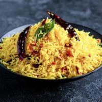 Lemon Rice · Tangy lemon flavor rice balanced with right tempering and nuts.