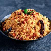 Tamarind Rice · Hot and tangy rice delicacy with tempering and nuts.