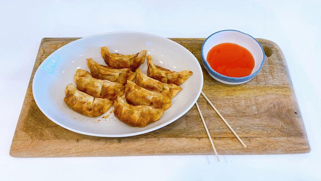 Potsticker 餃子 · fried pork and vegetables dumplings ( 8 pieces)