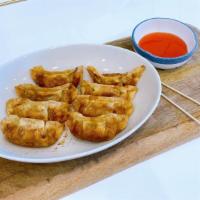 Potsticker 餃子 · Fried Chinese dumplings with pork and vegetables fillings ( 8 Pieces)