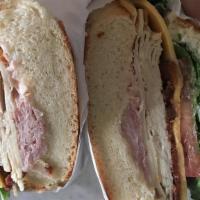 Club House · Ham, turkey, house bacon, swiss and American cheese, mayo, lettuce, tomato on our delicious ...