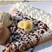 Nutella crepe with banana & strawberry  · Crepe with Nutella, banana & strawberry inside. Chocolate drizzle and powder sugar on top wi...