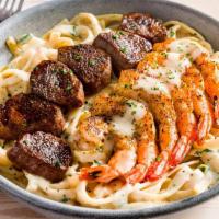 New! Kingsland Pasta · A steakhouse twist on your favorite Queensland Pasta. Grilled steak and shrimp over fettucci...