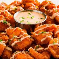 New! Bloomin' Fried Shrimp · Tender, bite-sized shrimp hand-breaded with our famous Bloomin' Onion spices and cooked unti...