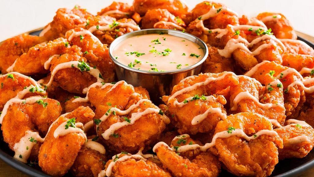 New! Bloomin' Fried Shrimp · Tender, bite-sized shrimp hand-breaded with our famous Bloomin' Onion spices and cooked until golden brown. Drizzled and served with our signature spicy bloom sauce..