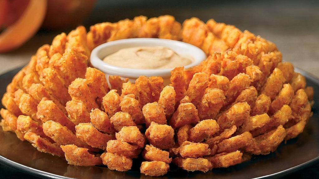 Bloomin' Onion® · An Outback Original! Our special onion is hand-carved, cooked until golden and ready to dip into our spicy signature bloom sauce.