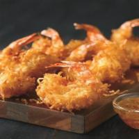 Gold Coast Coconut Shrimp** · Hand-dipped in batter, rolled in coconut and fried golden. Paired with Creole marmalade.
