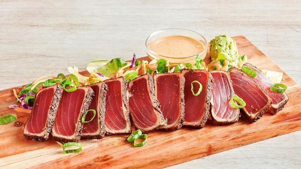 Seared Pepper Ahi* · Seared rare with garlic pepper seasoning. Served with a creamy ginger soy sauce and wasabi.