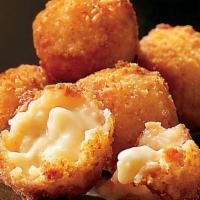 Steakhouse Mac & Cheese Bites · Eight golden bites filled with macaroni, Asiago, Mozzarella and Parmesan cheese. Served with...