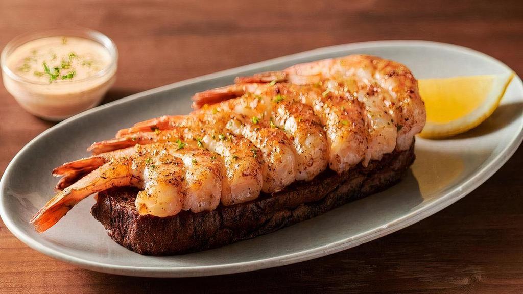 Grilled Shrimp On The Barbie · Seasoned with a special blend of herbs and spices then flame grilled. Served with Outback’s own garlic toast and classic rémoulade sauce.