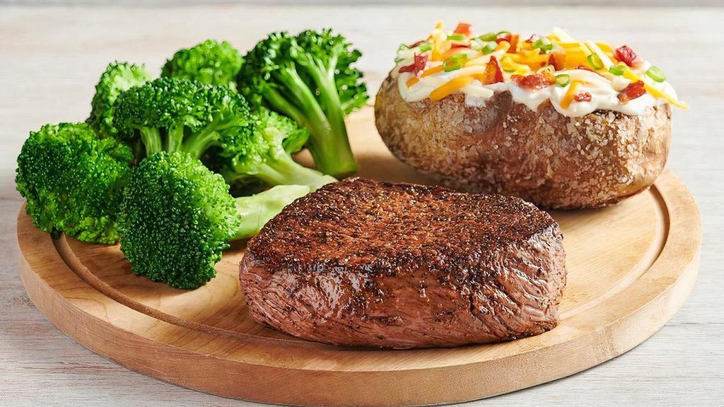 Outback Center-Cut Sirloin* · Center-cut for tenderness. Lean, hearty and full of flavor. Seasoned and seared. Served with two freshly made sides.