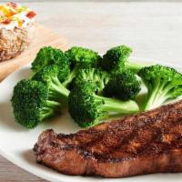 Bone-In New York Strip* 16 Oz. · Thick cut, bone-in and full of rich flavor. Served with two freshly made sides.