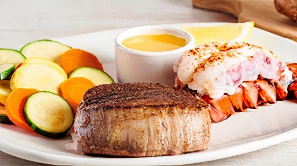 Victoria'S Filet® Mignon* & Lobster · A tender and juicy thick-cut filet paired with a steamed lobster tail. Served with a choice of two freshly made sides.