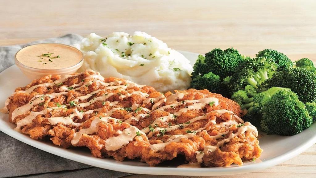 Bloomin' Fried Chicken · Our twist on fried chicken. Boneless chicken breast hand battered in our Outback Original Bloomin' Onion® seasoning, fried until golden brown and drizzled with our spicy signature bloom sauce. Served with a choice of two freshly made sides.