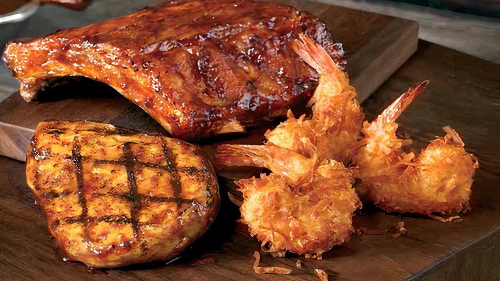 Bbq Mixed Grill · Flame-grilled chicken with Outback’s special BBQ sauce, fall-off-the-bone Baby Back Ribs and Coconut Shrimp all served with two freshly made sides.