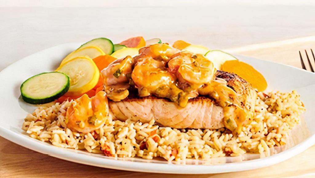 Toowoomba Salmon · Grilled Salmon topped with seasoned and sautéed shrimp tossed with mushrooms in a creamy creole sauce. Served with two freshly made sides.