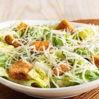 Caesar Side Salad · Romaine lettuce and homemade croutons tossed with traditional Caesar dressing. Topped with f...