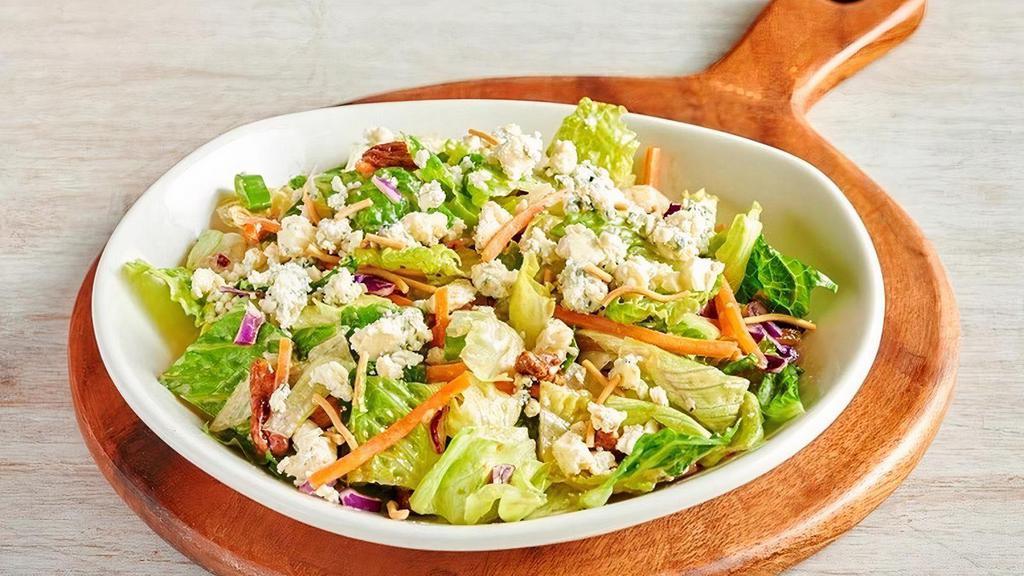 Blue Cheese Pecan Chopped Side Salad** · Chopped style mixed greens with shredded carrots, red cabbage, green onions, cinnamon pecans and Aussie Crunch all tossed with Blue Cheese vinaigrette and topped with Blue Cheese crumbles.