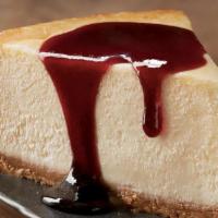 New York-Style Cheesecake · Aussie-sized slice of premium New York-style cheesecake served with a choice of raspberry or...