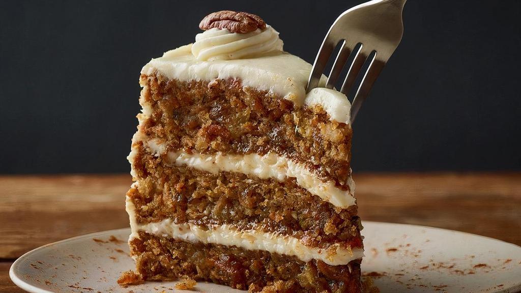 Triple-Layer Carrot Cake** · Moist layers of carrot cake with coconut and pecans topped with a sweet vanilla cream cheese icing.