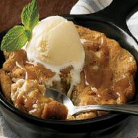 Salted Caramel Cookie Skillet** · A warm salted caramel cookie with pieces of white chocolate, almond toffee and pretzels, toa...