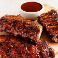 Baby Back Ribs Party Platter · Three 1/2 racks of Baby Back Ribs. Smoked, grilled and brushed with a tangy BBQ sauce. Serve...