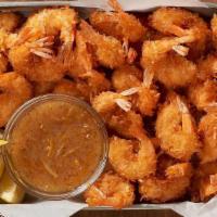 Gold Coast Coconut Shrimp Party Platter · 32 shrimp hand-dipped in batter, rolled in coconut and fried golden. Paired with Creole marm...