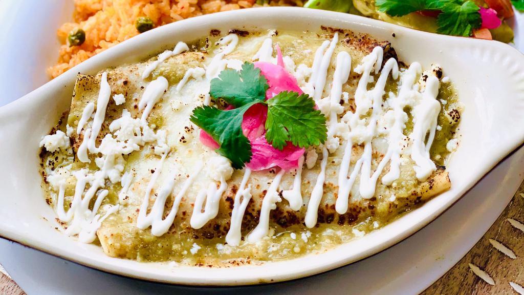 Enchiladas Verdes o Rojas · Choice of chicken or cheese enchiladas, smothered in either our red or green salsas. Topped with sour cream and queso fresco, served w/ a side of rice and refried beans.