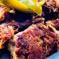 Carnitas Plate · Tender slow roasted pulled pork, served w/ rice & refried beans, shredded lettuce, pico de g...