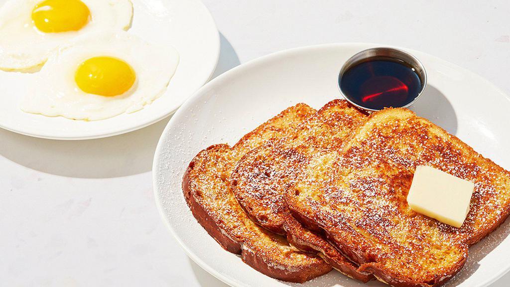 French Toast Combo · Two slices of thick, egg-washed cinnamon bread served with maple syrup and powdered sugar, plus your choice of breakfast meat and two eggs your way.