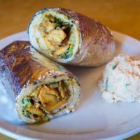 Desi Chicken Wrap · This spicy version of our classic chicken wrap features tomatoes, onions, cilantro and green...