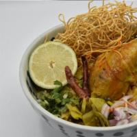 Khao Soi · Traditional golden triangle egg noodles with chicken drumstick, shallot, and pickled mustard...