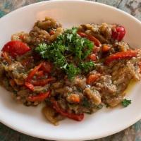 Melitzanosalata · smoked eggplant, roasted red bell pepper, garlic, parsley and olive oil
