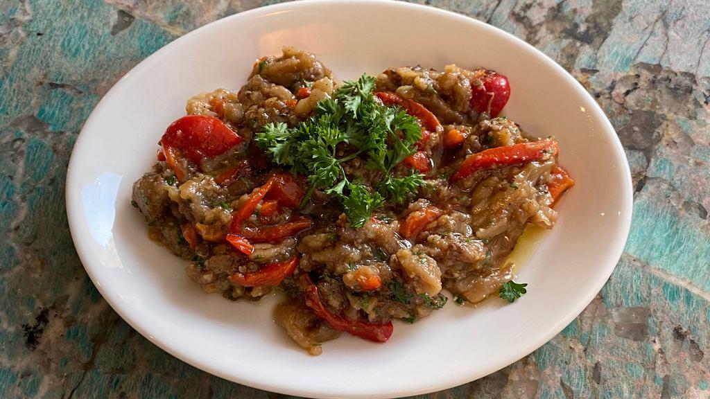 Melitzanosalata · smoked eggplant, roasted red bell pepper, garlic, parsley and olive oil
