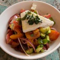 Horiatiki · classic Greek salad of tomato, cucumber, bell pepper, onion, olives & feta.