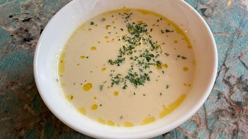 Avgolemono · traditional egg-lemon soup with pulled chicken & orzo.